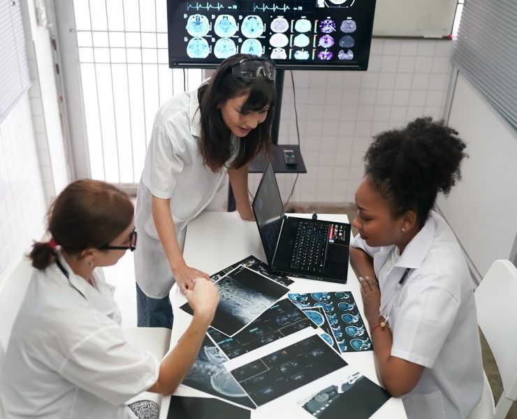 Medical Workplace Healthcare. Multiethnic doctor Team Wearing Medical Masks Having Meeting In Office