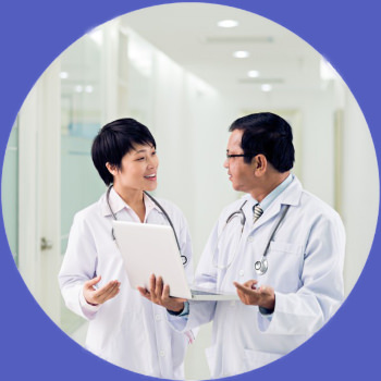 Female and male doctors discuss best thoracic outlet syndrome test